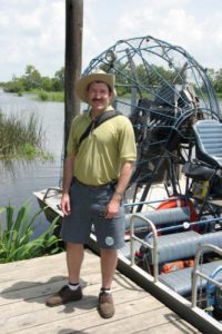 Taking a swamp boat to view alligators