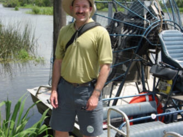 Taking a swamp boat to view alligators