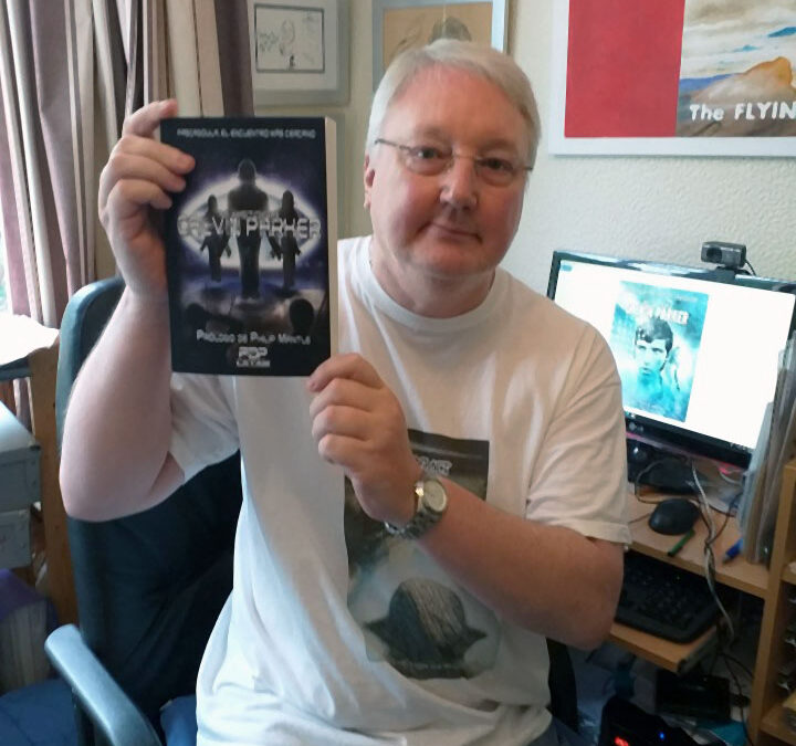 Philip Mantle Holding The New Spanish Language Edition