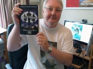 Philip Mantle Holding The New Spanish Language Edition