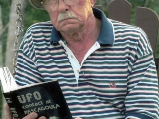 Charlie Hickson with his book UFO Contact at Pascagoula (image credit: AP Photo / Christy Jerrnigan)