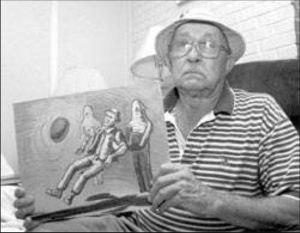 Charles Hickson holds drawing of his alleged 1973 UFO abduction
