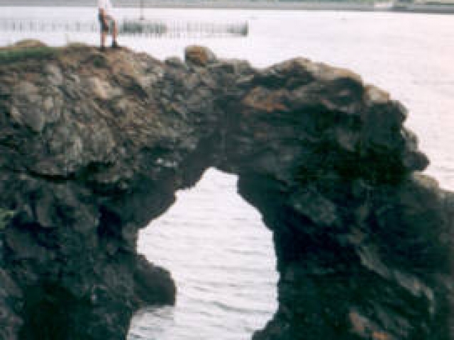 Standing on top of the &quot;Hole In The Wall&quot; on Mackinac Island, Michigan
